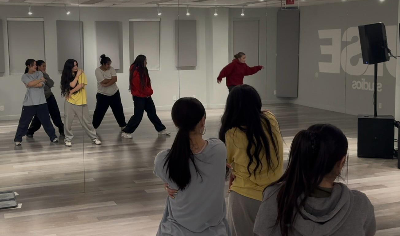 Members of Flomatk in a Hip Hop training session at PULSE Studios, following choreography and preparing for an upcoming performance.