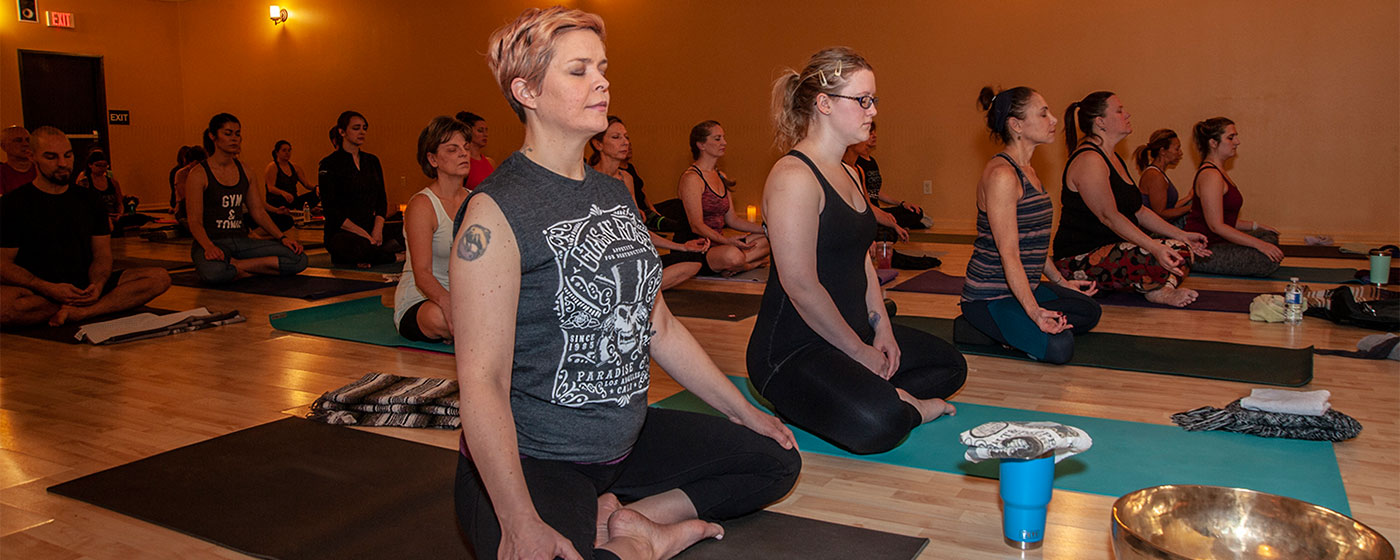 group of people in a yoga class at Red Lotus Yoga in rochester hills, mi