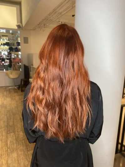 back woman wavy red hair