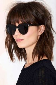 woman with brown brow-grazing bangs