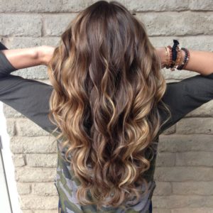 woman with long curly balayage hair