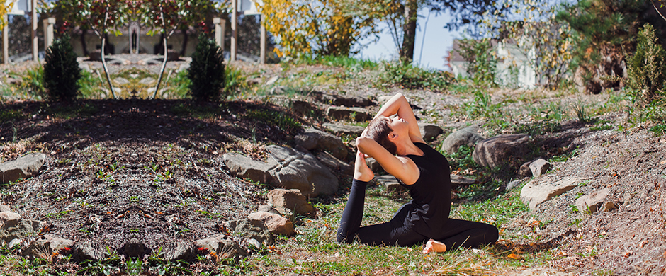 Woman Doing a Yoga Pose in an Old River Bed