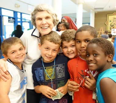 Mary Jo Copeland with a group of young boys