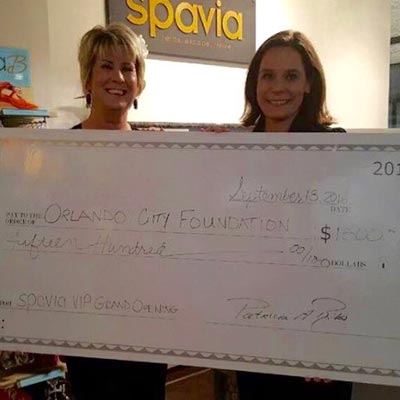 spavia franchise owners making a donation to charity