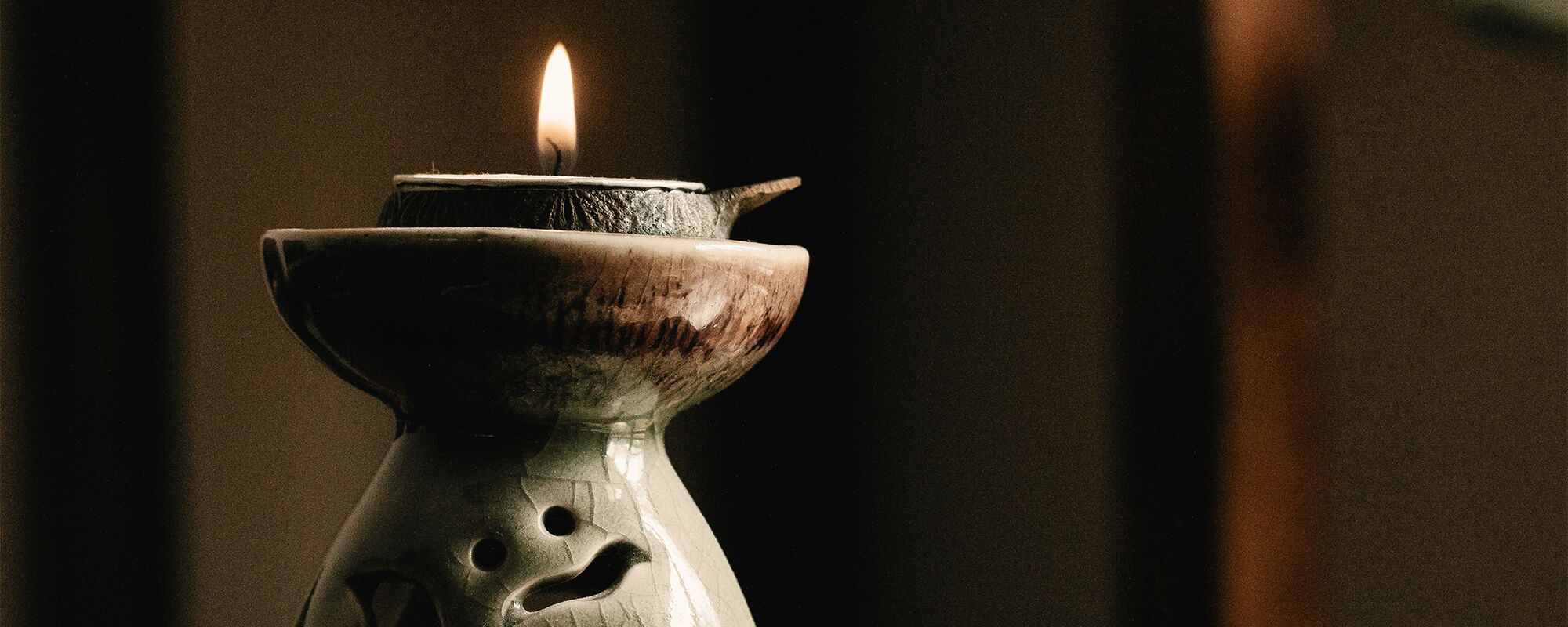lit candle at a spavia franchise