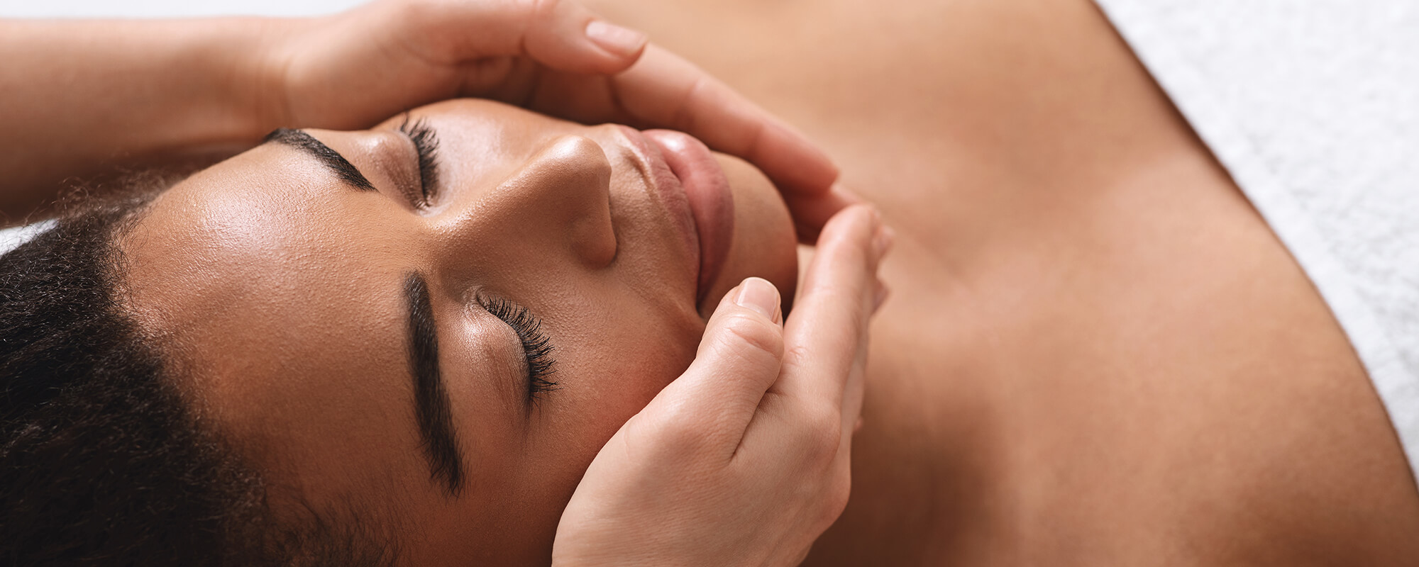 woman receiving a facial treatment at a spavia franchise