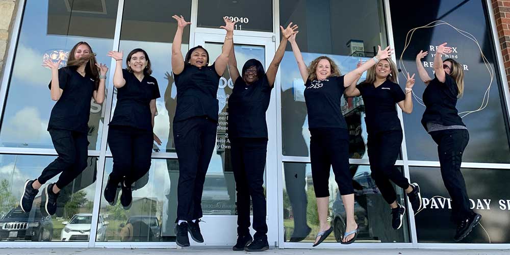 spavia staff celebrating the in front of the franchise