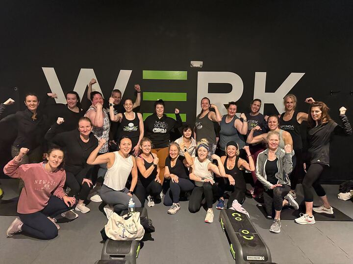 Group of SPENGA members Infront of a wall that says "werk"