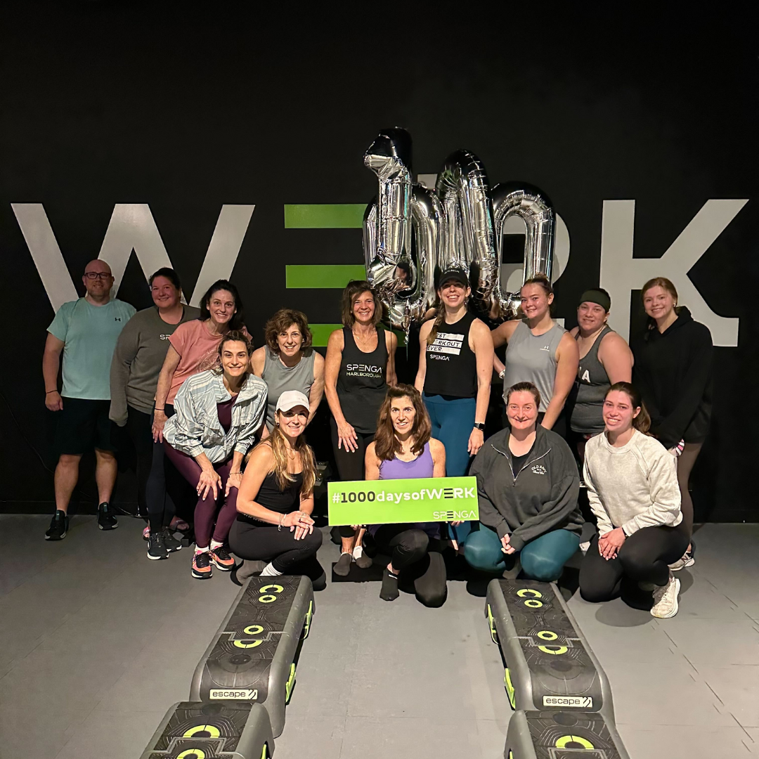 Group of SPENGA members holding a 1000 days of werk sign
