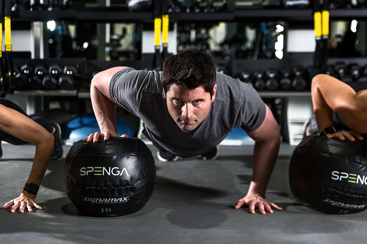 man using a medicine ball at spenga