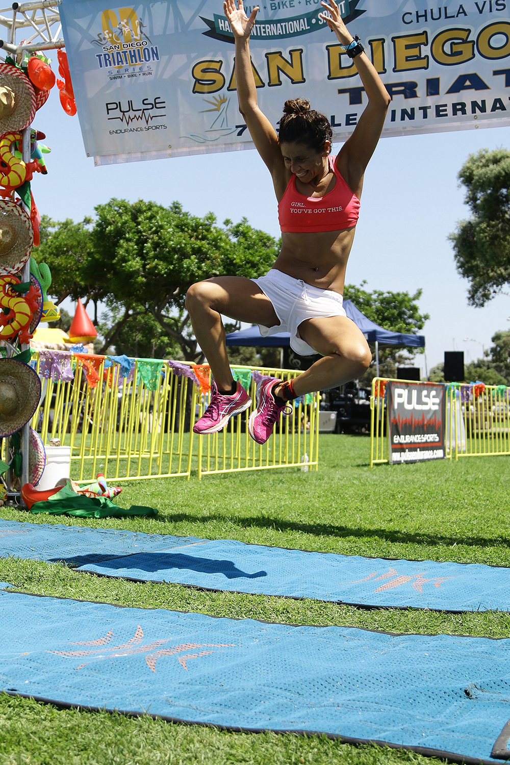 woman finishing triathlon