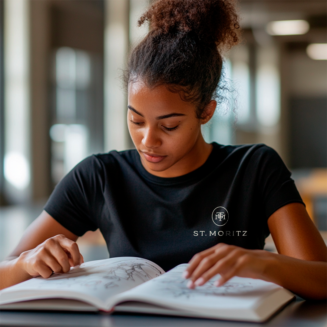 Student at St Moritz reading a textbook