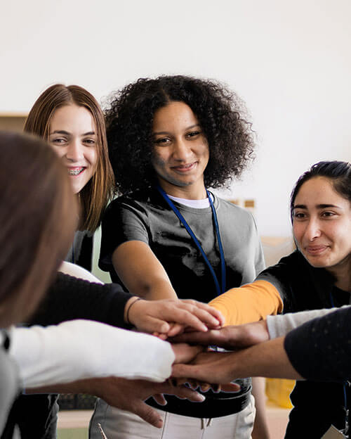 hands-teamwork-donation-box