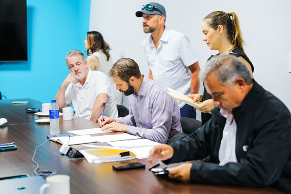 switchback-medical-team-signing-at-table