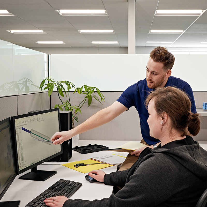 switchback medical staff using a computer to review medical device prototyping