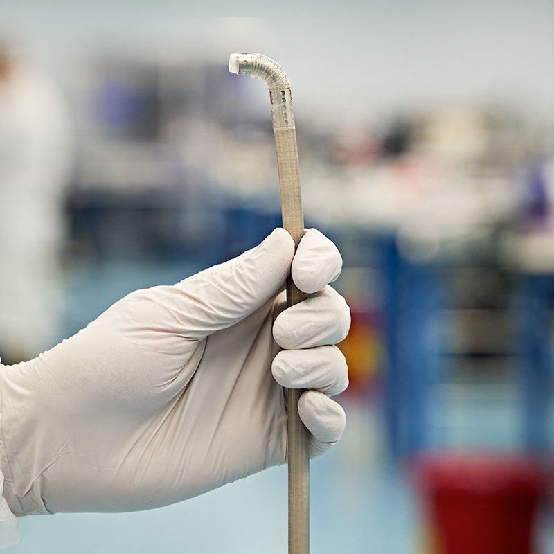 hand holding a catheter