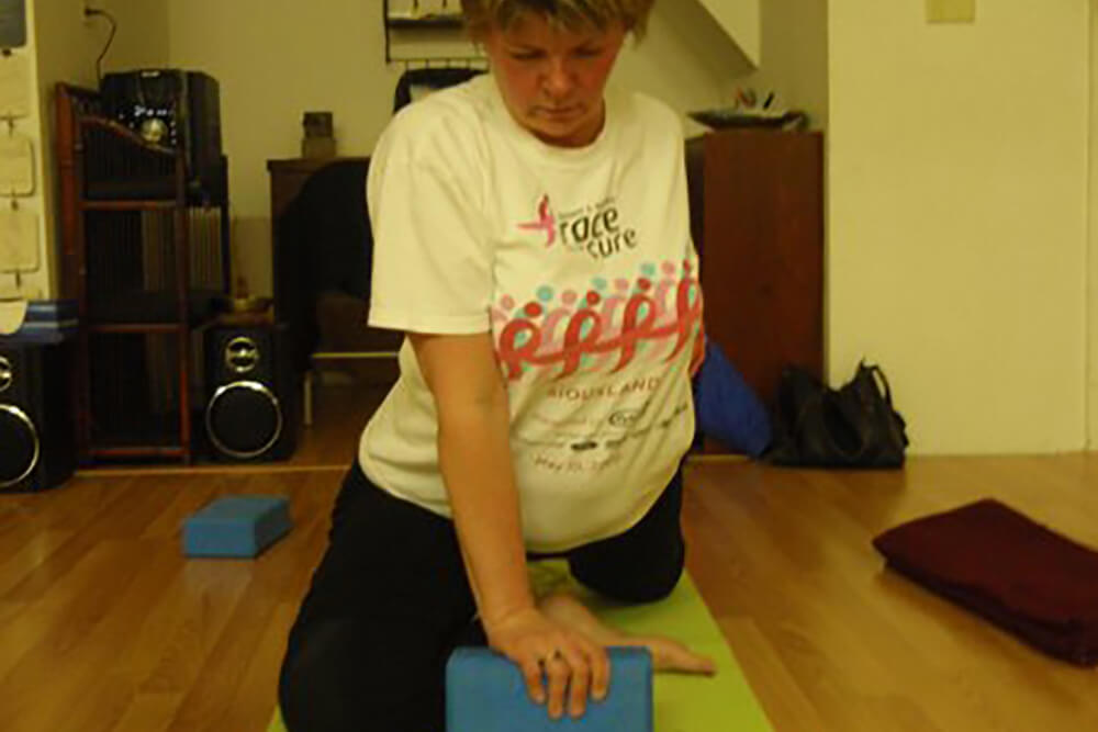 woman using yoga block