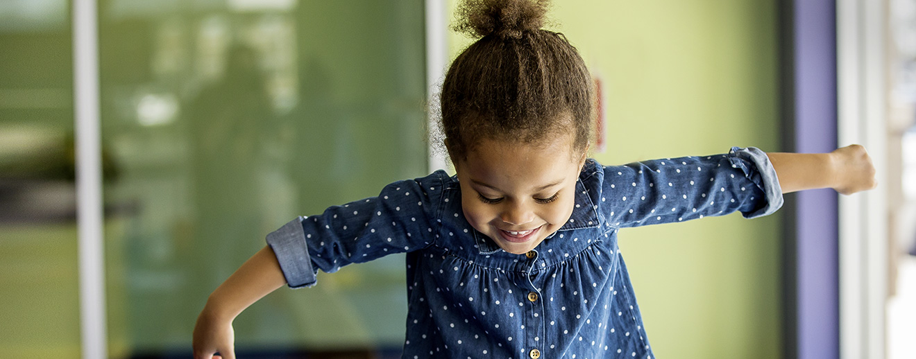 girlSmilingBalanceBeam