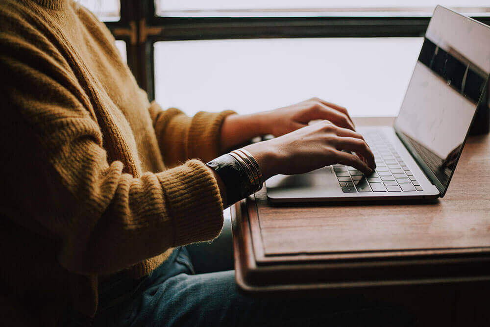 woman-typing-laptop