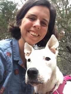 the owner of Mariposa Heartworks with a dog on a hike