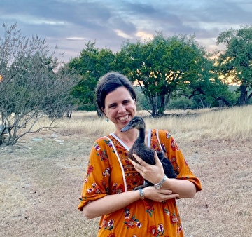 the owner of Mariposa Heartworks holding a duck