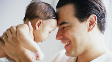 Father holding baby at Yoga Bumps & Babies