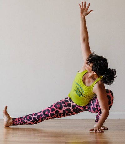 Premium Photo | Young woman athlete performing a side lunge yoga pose or  skandasana to strengthen and stretch her hamstrings, glutes and quads  muscles in a low angle view in a high